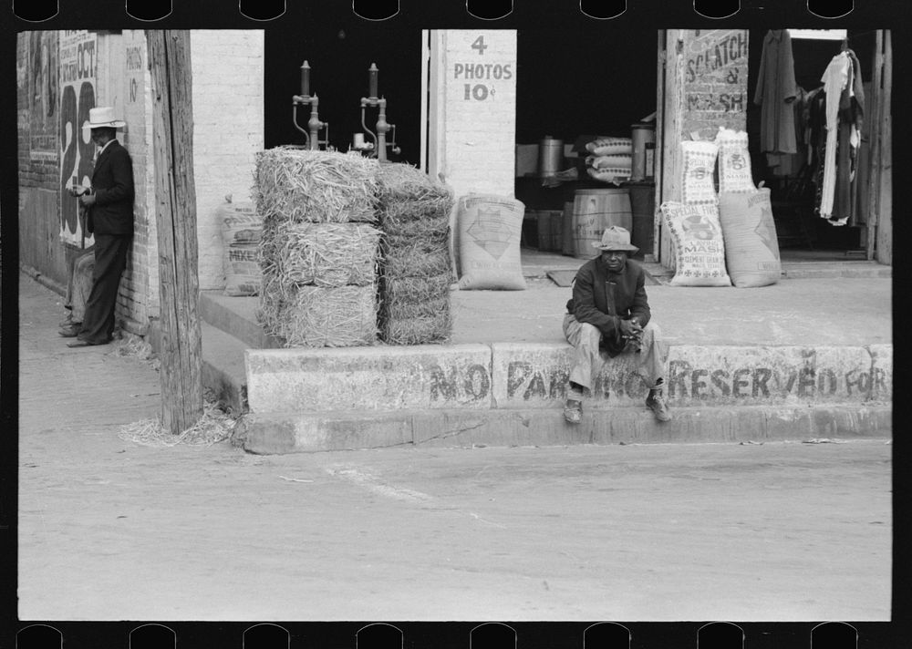 [Untitled photo, possibly related to: Street corner of market square, Waco, Texas] by Russell Lee