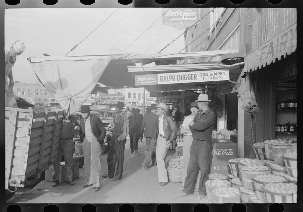 [Untitled photo, possibly related to: Saleswoman at grocery store, Waco, Texas] by Russell Lee