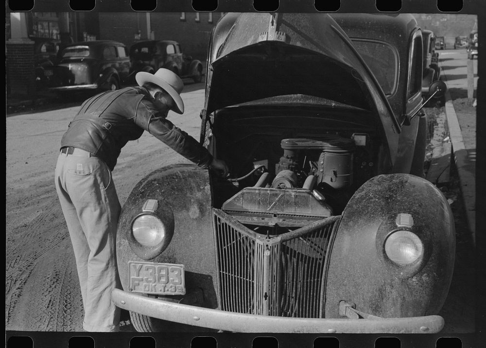 Farmer working on his car while he is in town, Eufaula, Oklahoma by Russell Lee