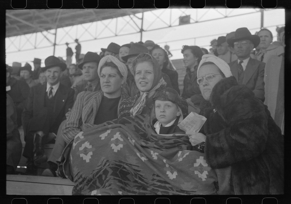 [Untitled photo, possibly related to: Spectators at a tense moment during the rodeo at the San Angelo Fat Stock Show, San…