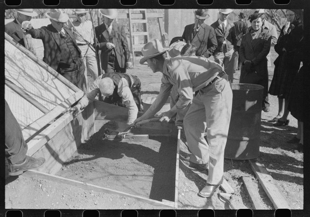 FSA (Farm Security Administration) Supervisor and a rehabilitation borrower preparing and leveling off the seed bed of a…