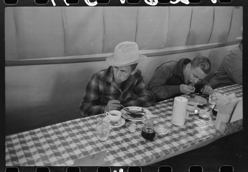 Cowboys eating breakfast at restaurant on the grounds of the San Angelo Fat Stock Show, San Angelo, Texas by Russell Lee