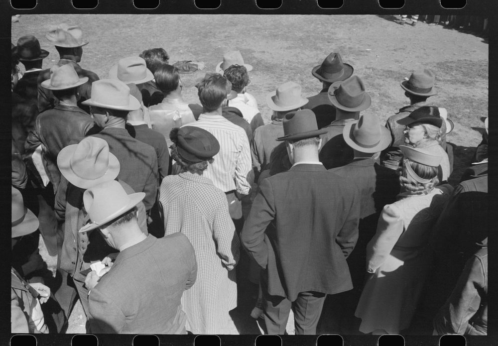 Backs of spectators at a sideshow, San Angelo Fat Stock Show, San Angelo, Texas by Russell Lee