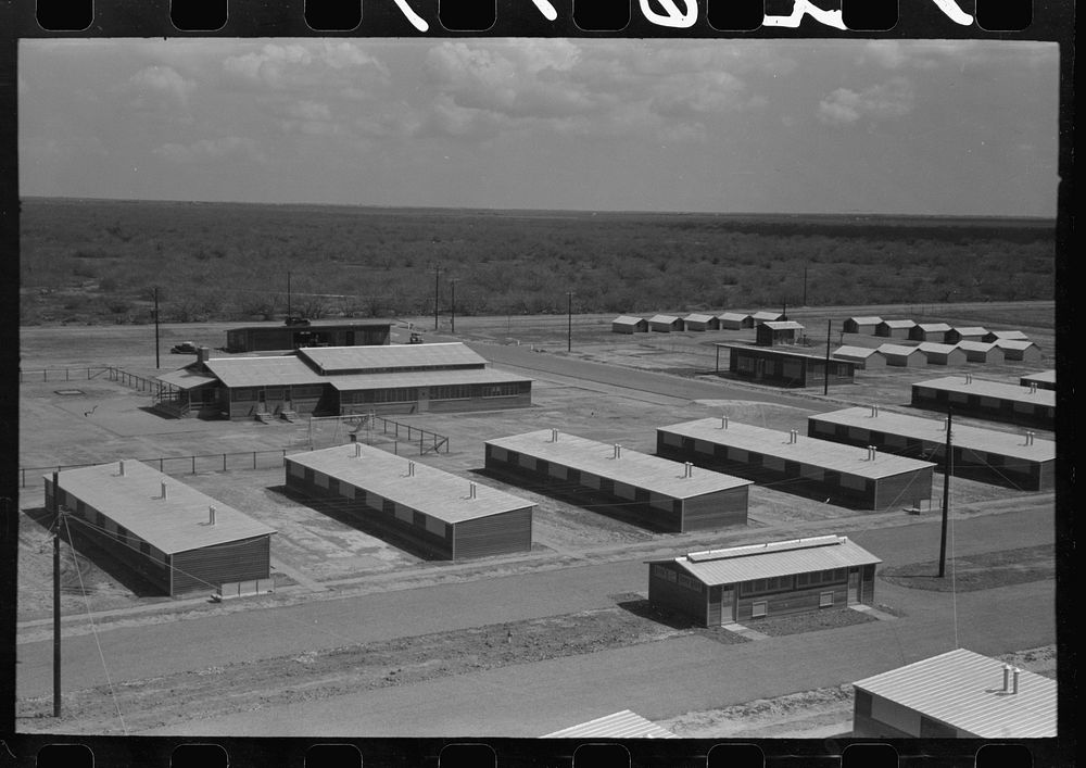 [Untitled photo, possibly related to: Row shelters in foreground, isolation units in right background, community house in…