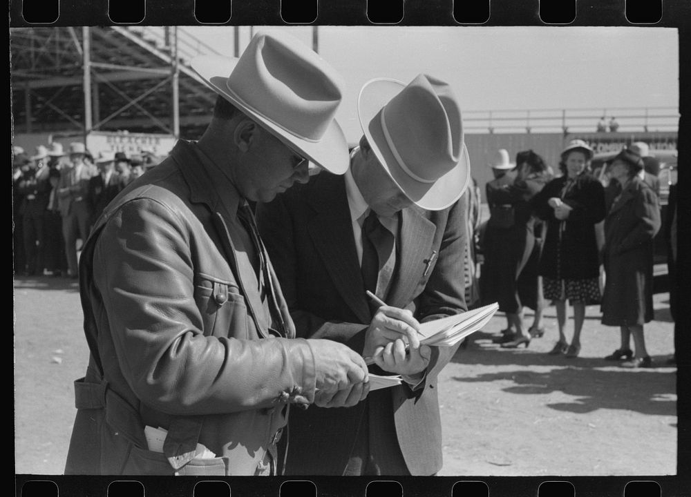 Judges of horses checking the entries at the San Angelo Fat Stock Show, San Angelo, Texas by Russell Lee