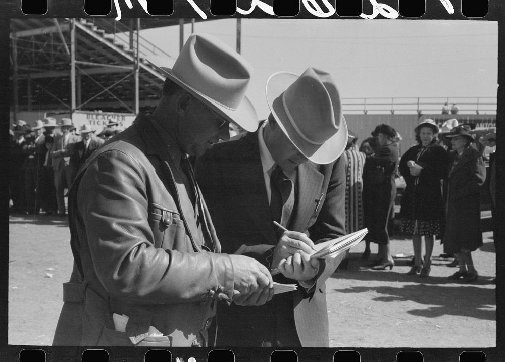 Judges of horses checking the entries at the San Angelo Fat Stock Show by Russell Lee