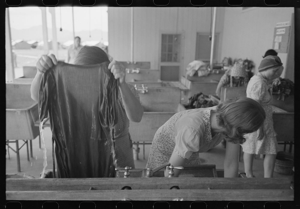 [Untitled photo, possibly related to: Wives of migratory laborers washing their family laundry at the Agua Fria Migratory…