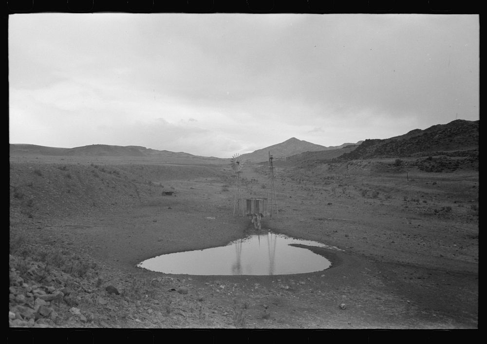 [Untitled photo, possibly related to: Stock waterhole and windmill, Socorro County, New Mexico] by Russell Lee