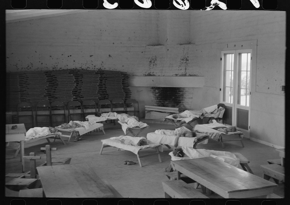 [Untitled photo, possibly related to: Children taking their nap at the Work Projects Administration nursery school at the…