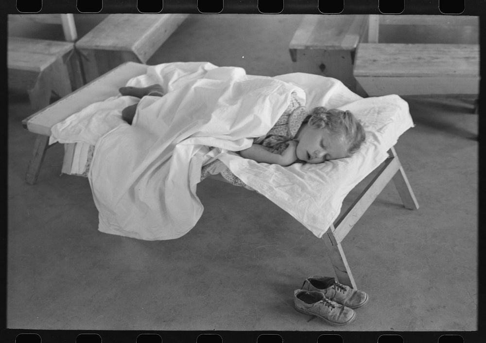 [Untitled photo, possibly related to: Little girl taking her nap at the Work Projects Administration nursery school at the…