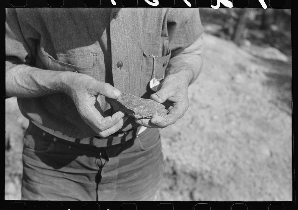Piece of ore in hand of prospector, Pinos Altos, New Mexico by Russell Lee