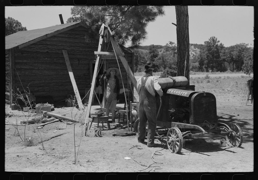 Farmer and his wife drilling water well with cable tools, Pie Town, New Mexico by Russell Lee