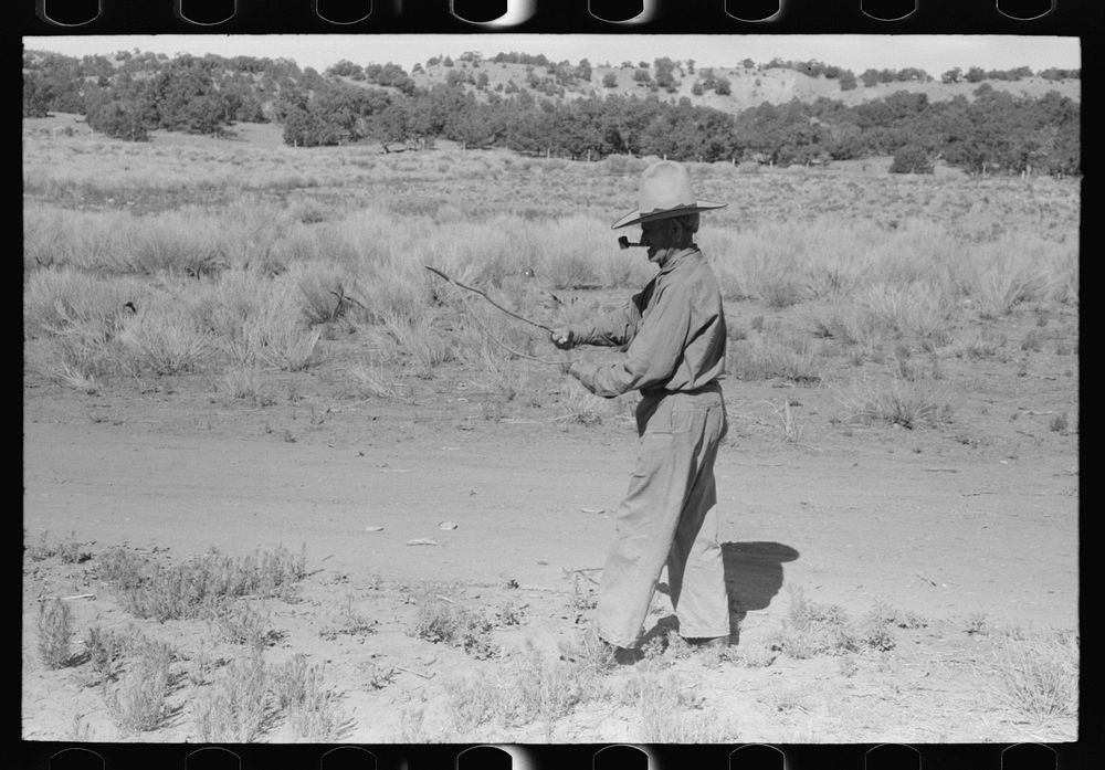 Water witch walks in the direction that stick heads him. Pie Town, New Mexico by Russell Lee