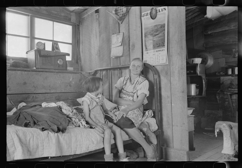 [Untitled photo, possibly related to: Mrs. Caudill and her daughter in their dugout, Pie Town, New Mexico. The Caudills have…