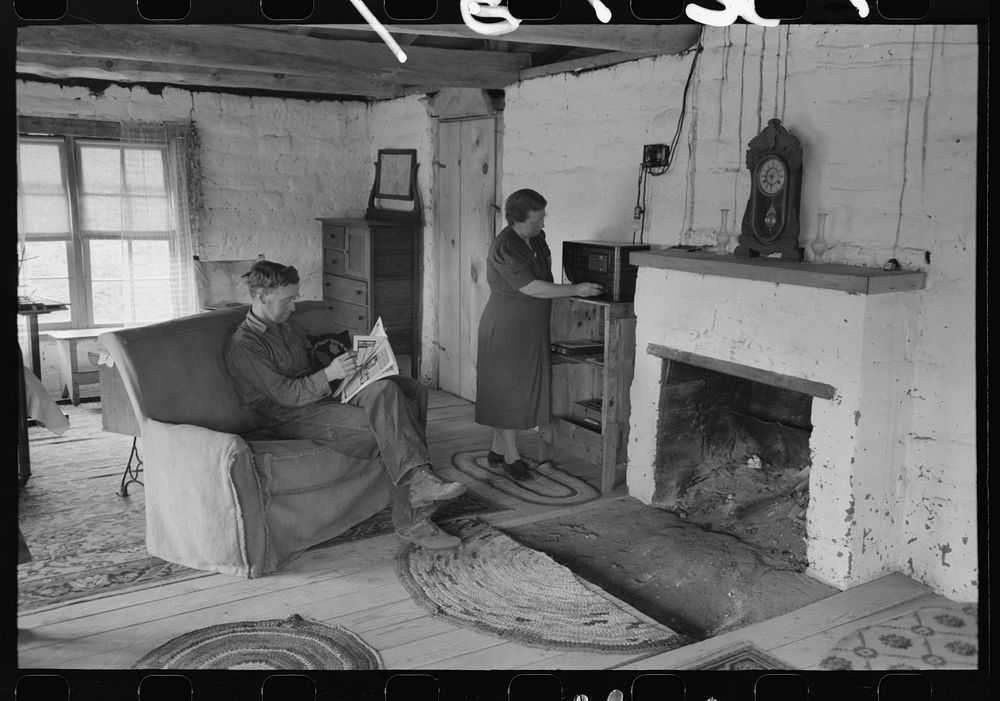 [Untitled photo, possibly related to: Homesteader and his wife in the living room of their new adobe house. This couple came…