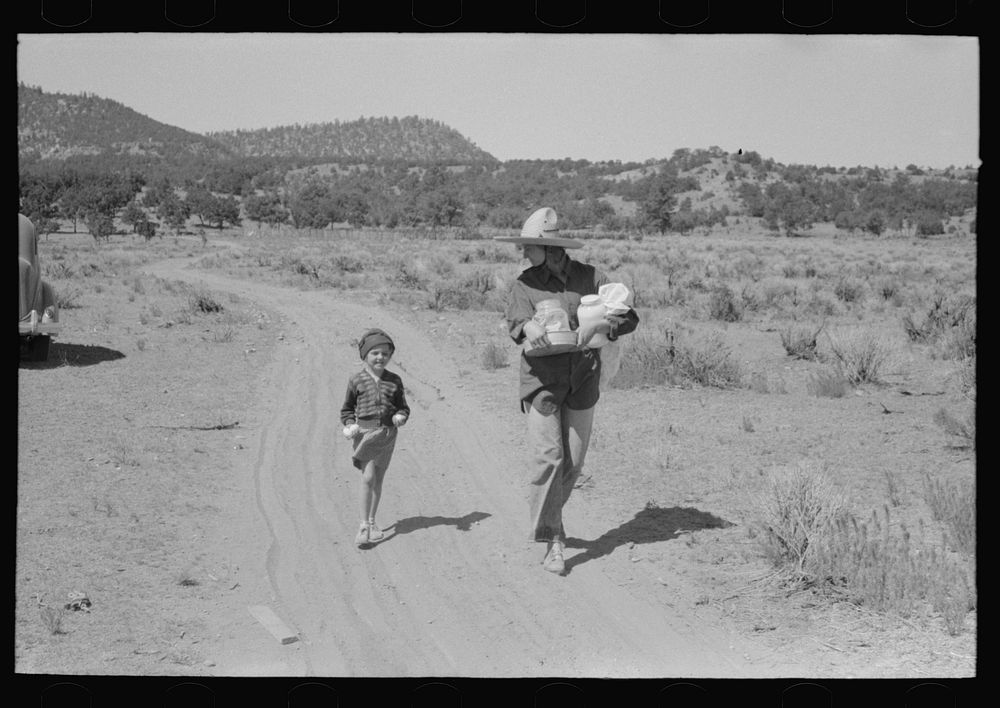 [Untitled photo, possibly related to: Mrs. Caudill and daughter carrying household equipment to new dugout. Pie Town, New…
