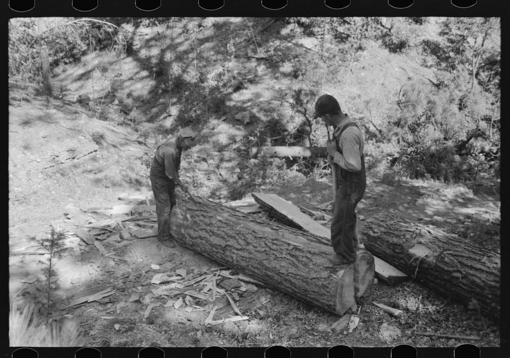 Splitting log which will be cut with broadaxe into ties. Pie Town, New Mexico by Russell Lee