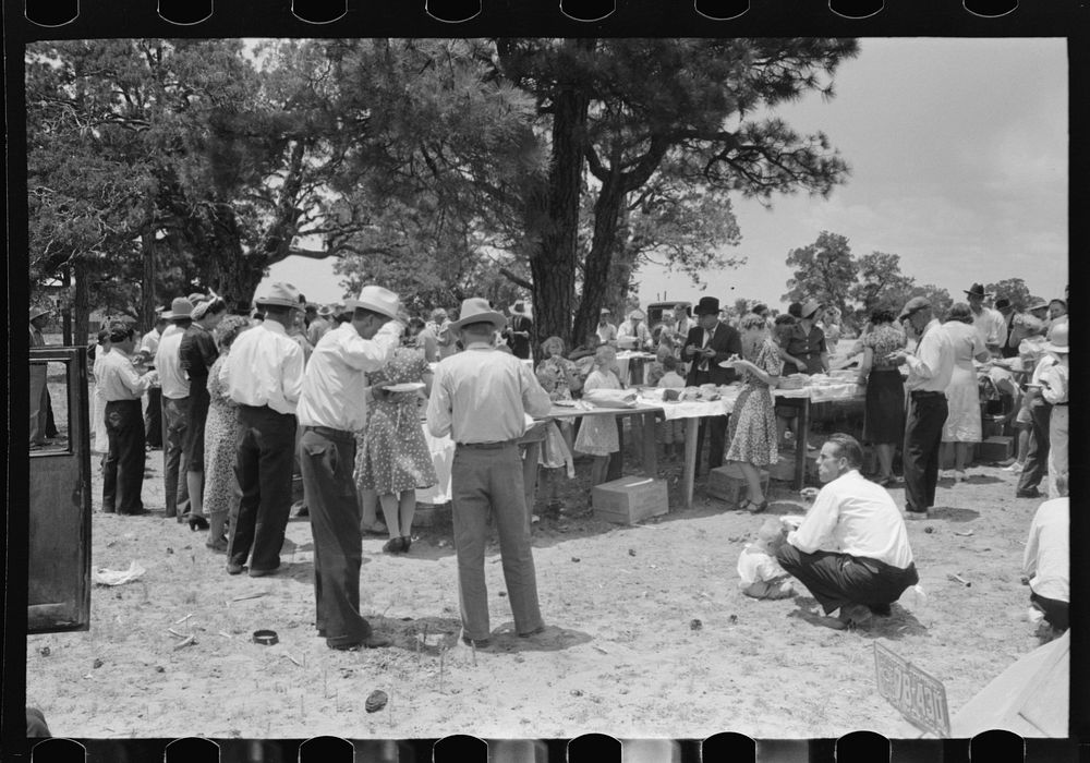 Dinner on the grounds at all day community sing, Pie Town, New Mexico. The tables are left in place permanently and are used…