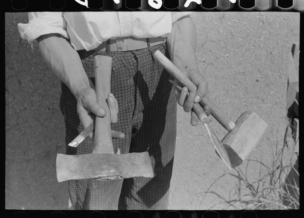 Handmade tools of Spanish-American farmer at Chamisal, New Mexico. The axe was made by welding two automobile spring leaves…