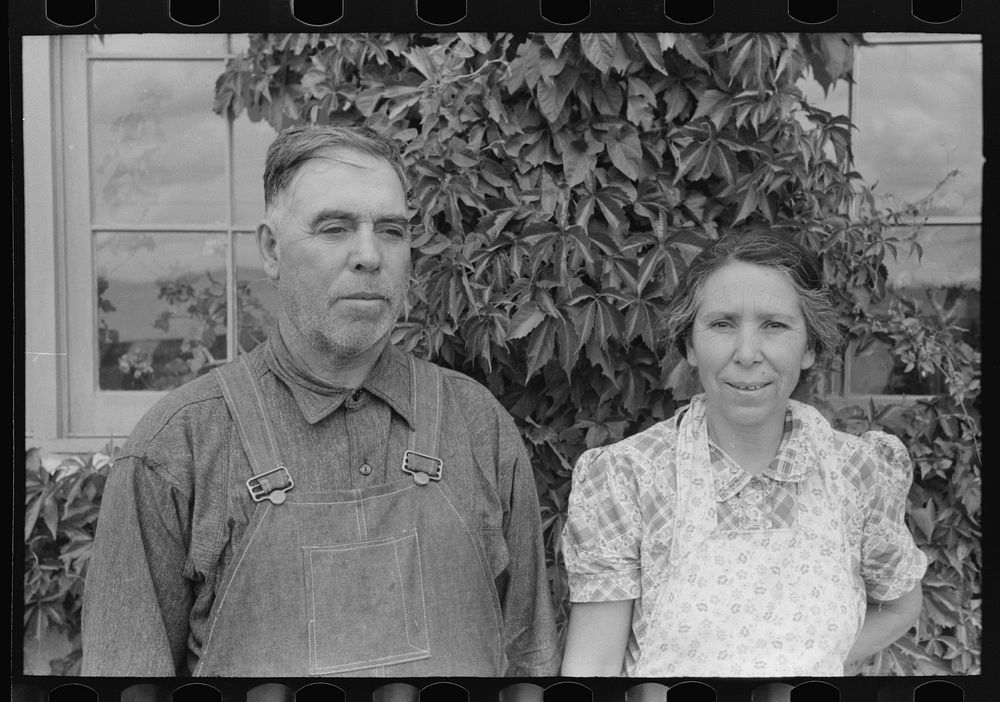 Spanish-American farmer and his wife, Chamisal, New Mexico by Russell Lee