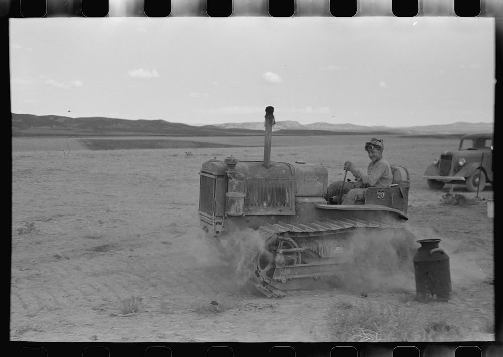 Son of dry farmer operating tractor, Oneida County, Idaho by Russell Lee