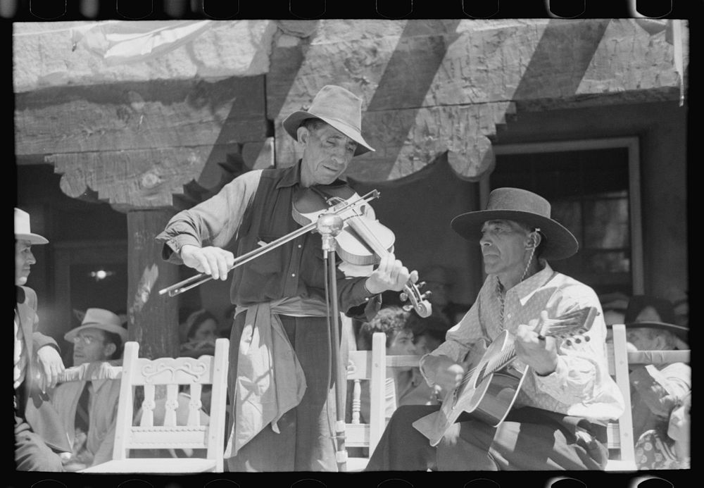 [Untitled photo, possibly related to: Spanish-American musicians playing at the fiesta at Taos, New Mexico] by Russell Lee