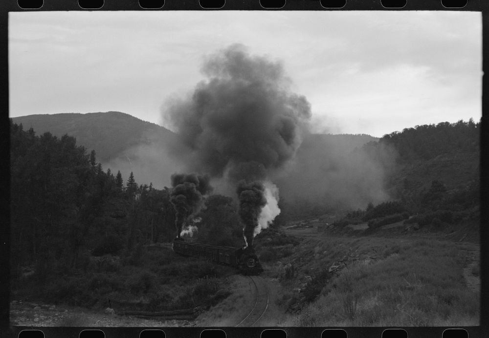 [Untitled photo, possibly related to: Train coming up the valley on a narrow gauge track, Ouray County, Colorado. Notice the…