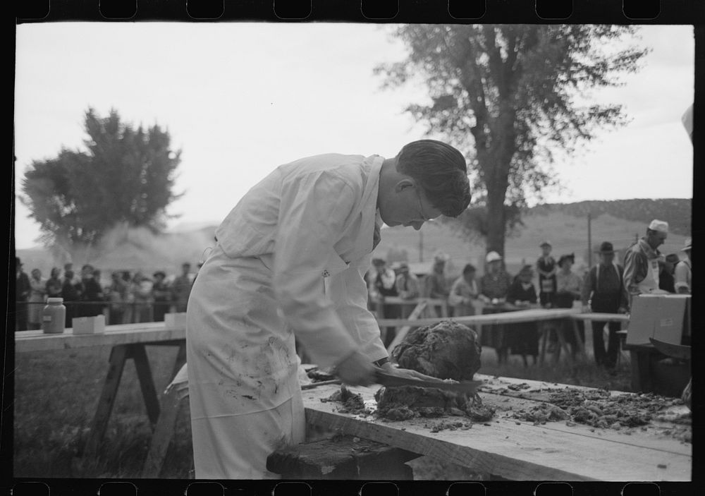 [Untitled photo, possibly related to: Making barbecue sandwiches at the free barbecue on Labor Day, Ridgway, Colorado] by…