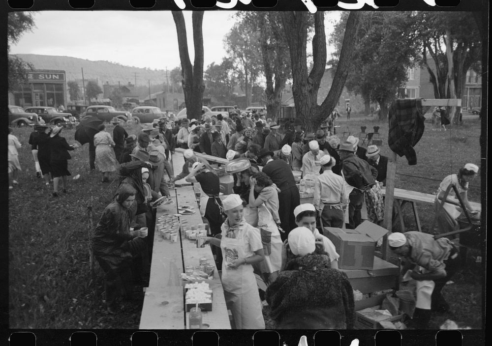 [Untitled photo, possibly related to: Making barbecue sandwiches at the free barbecue on Labor Day, Ridgway, Colorado] by…