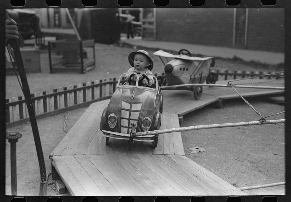 [Untitled photo, possibly related to: People on one of the rides on amusement row at the Labor Day celebration, Silverton…