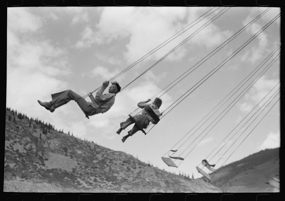 People on one of the rides on amusement row at the Labor Day celebration, Silverton, Colorado by Russell Lee