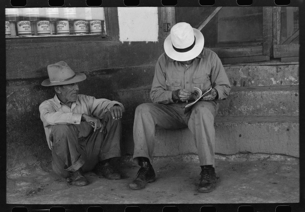 Residents of Concho, Arizona, sitting on the store steps by Russell Lee