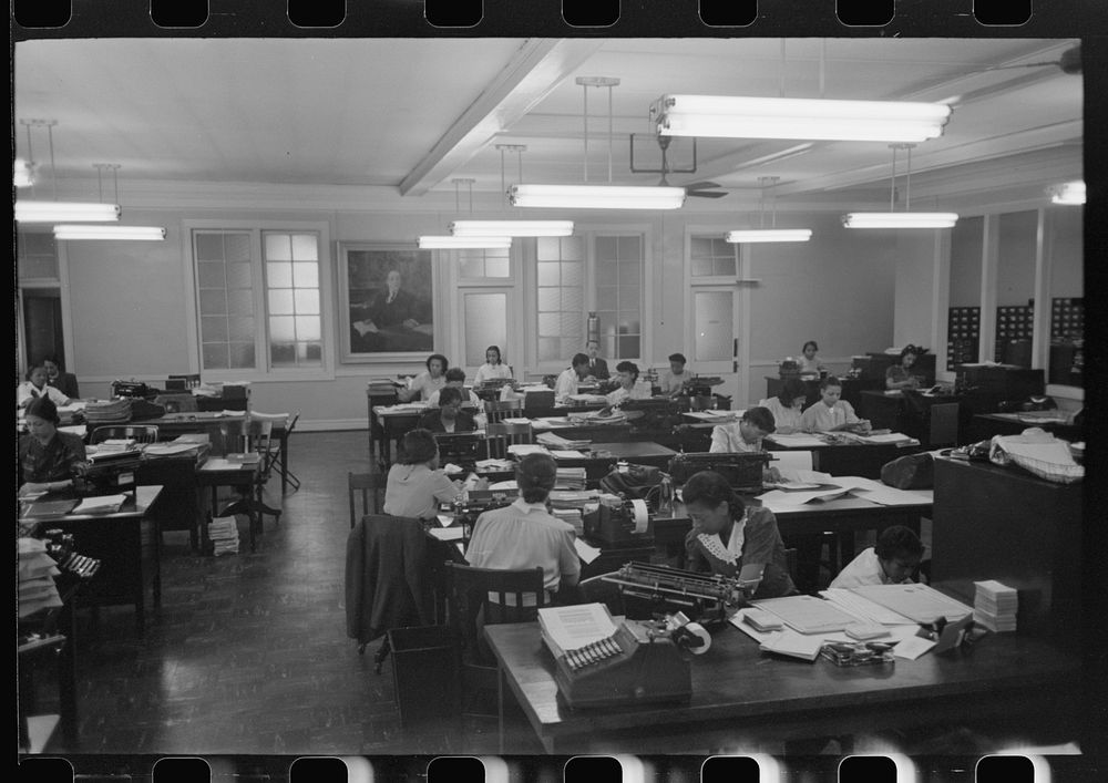 [Untitled photo, possibly related to: Employees in insurance company office, South Side of Chicago, Illinois] by Russell Lee