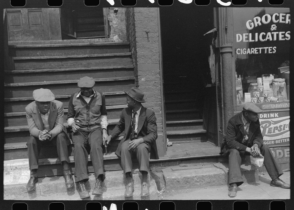[Untitled photo, possibly related to: People sitting on front porches in African American section of Chicago, Illinois] by…