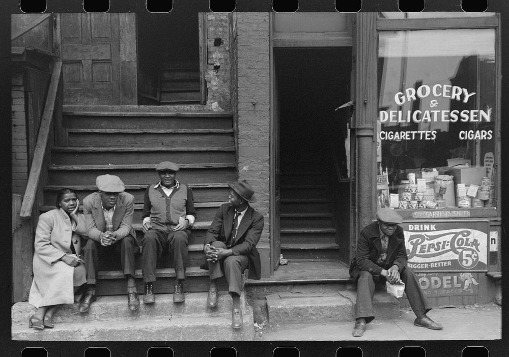 People sitting on front porches in  section of Chicago, Illinois by Russell Lee