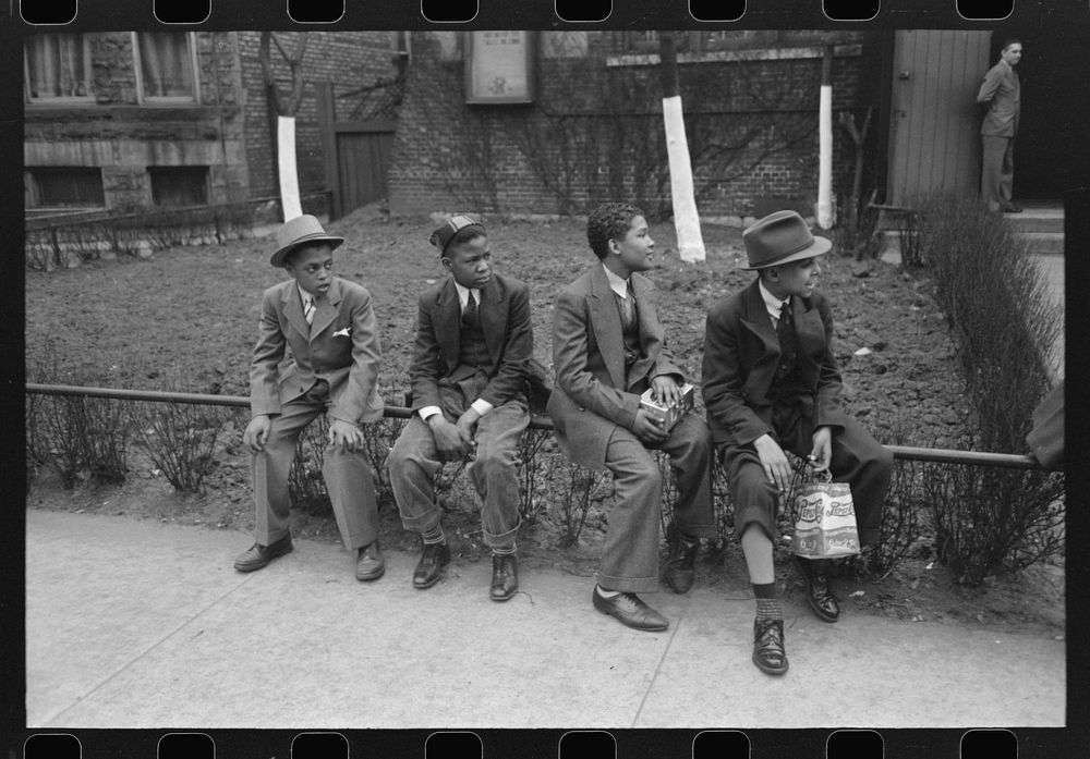 Boys waiting outside of Episcopal Church to see the processional, South Side of Chicago, Illinois by Russell Lee