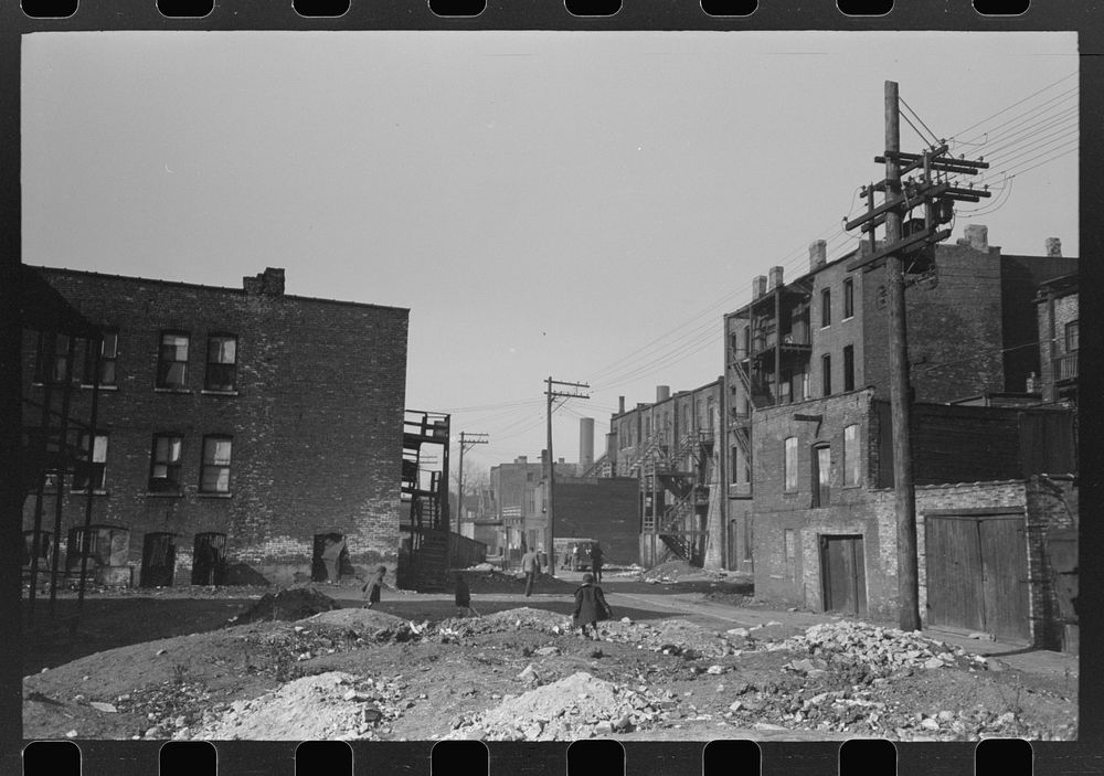 Vacant lots and apartment buildings in African American section of Chicago, Illinois by Russell Lee