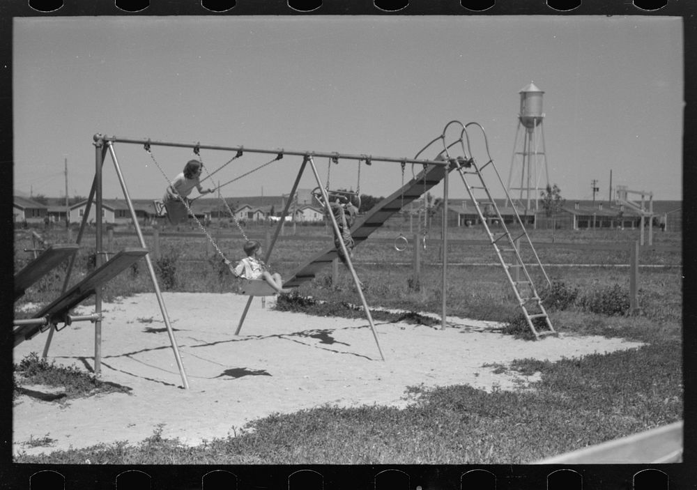 [Untitled photo, possibly related to: Children playing on slide at FSA (Farm Security Administration) labor camp, Caldwell…