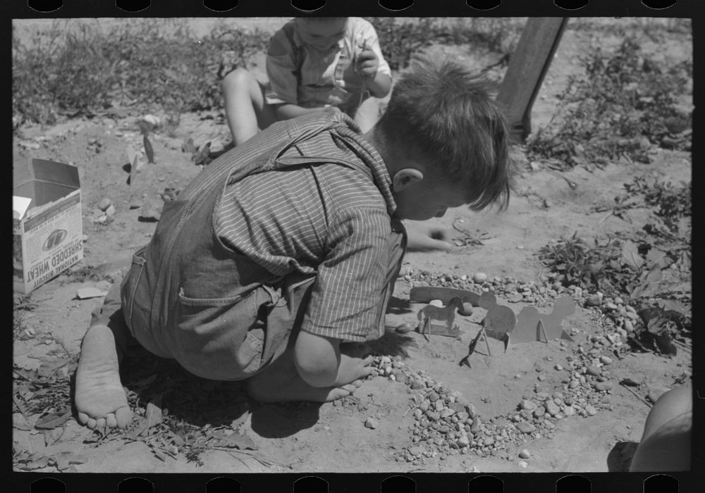 Son of the farm worker at the FSA (Farm Security Administration) labor camp. Caldwell, Idaho by Russell Lee