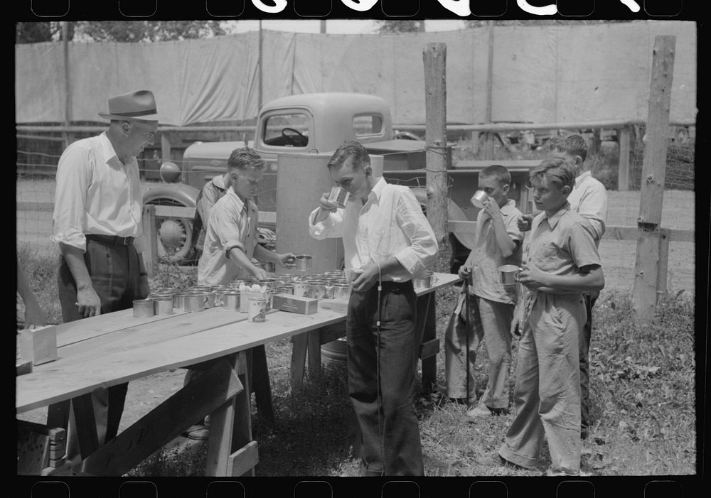 Free coffee stands at the picnic grounds on the Fourth of July. Vale, Oregon by Russell Lee