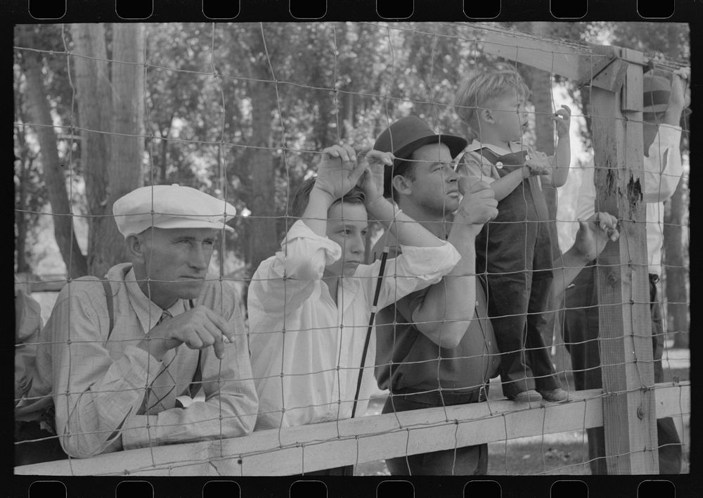 Spectators watch the baseball game on the Fourth of July at Vale, Oregon by Russell Lee