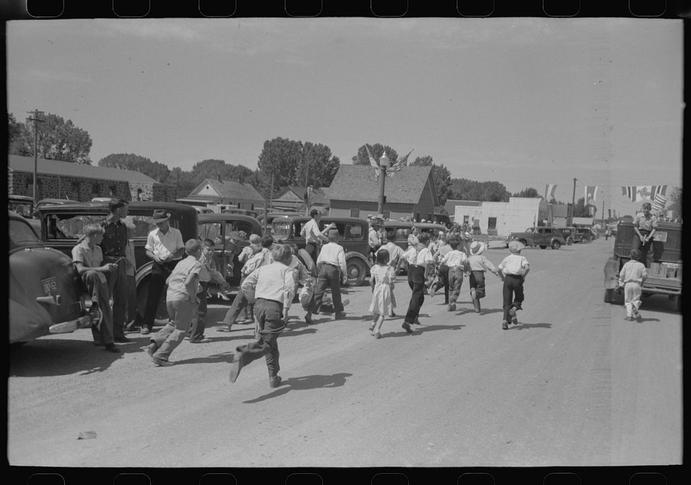 [Untitled photo, possibly related to: Street scene after the Fourth of July parade at Vale, Oregon] by Russell Lee