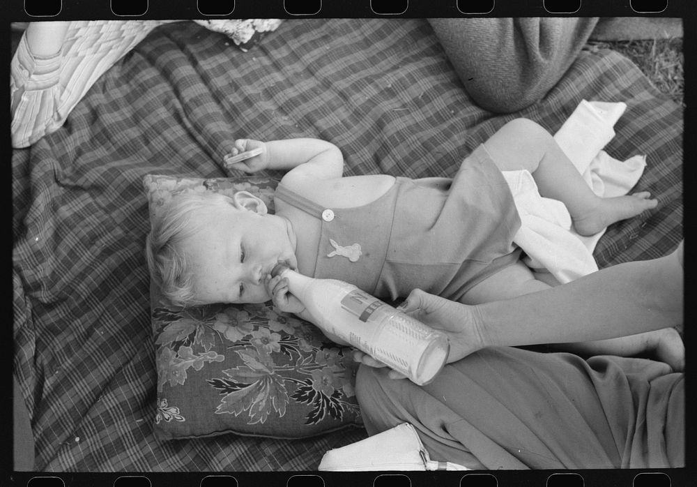 Baby at a picnic, Fourth of July, Vale, Oregon by Russell Lee