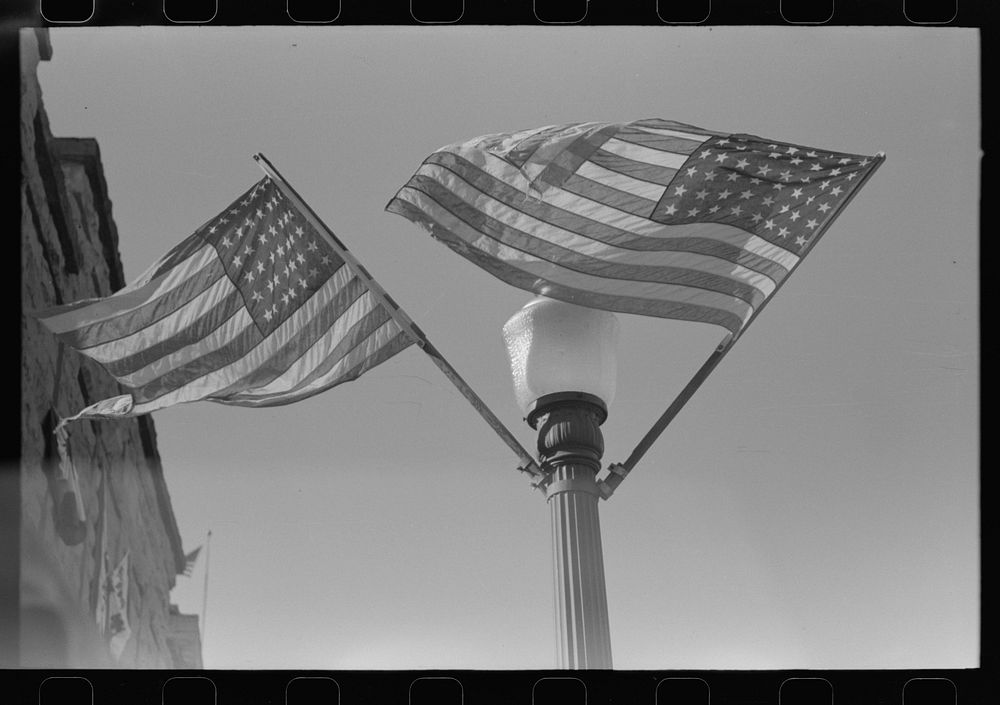 The flags are out on the Fourth of July, Vale, Oregon by Russell Lee