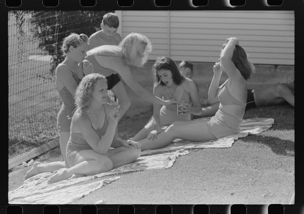 Sun bathers at the park swimming pool, Caldwell, Idaho by Russell Lee