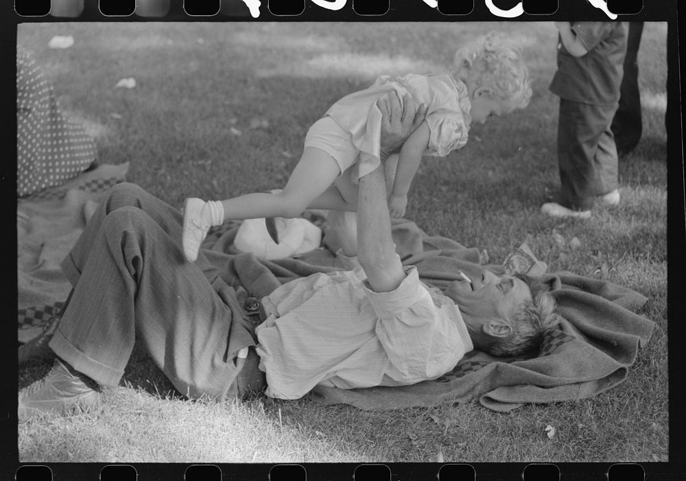 [Untitled photo, possibly related to: Farmer with his granddaughter at picnic on Fourth of July. Vale, Oregon] by Russell Lee