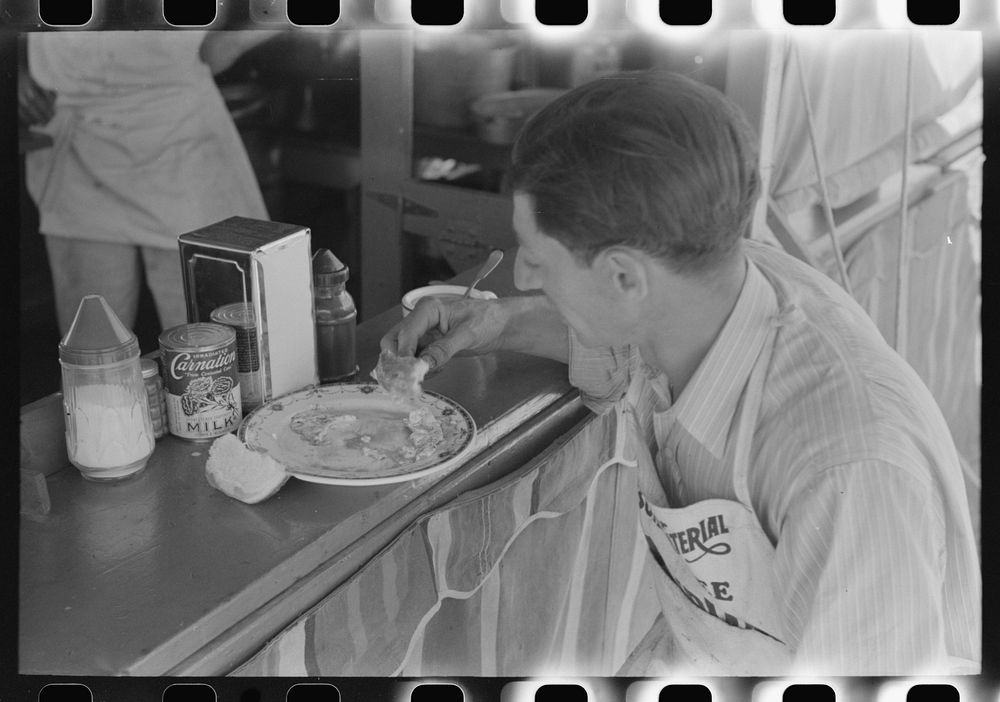 Lunch at carnival stand, Fourth of July, Vale, Oregon by Russell Lee