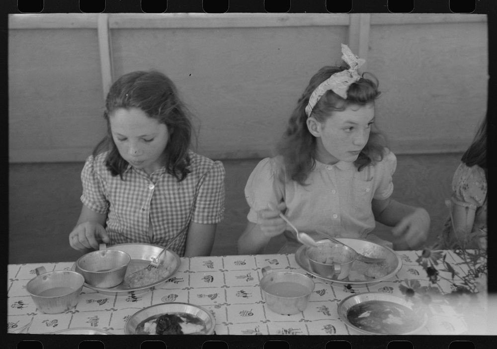 [Untitled photo, possibly related to: Lunch for children at the FSA (Farm Security Administration)'s mobile camp for…