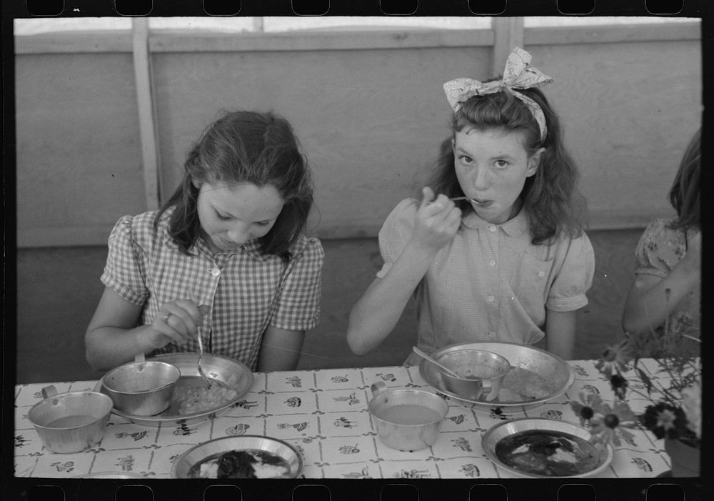 [Untitled photo, possibly related to: Lunch for children at the FSA (Farm Security Administration)'s mobile camp for…