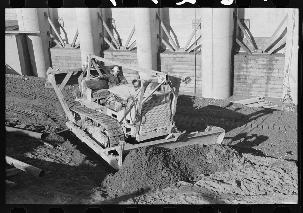 Bulldozer at work at Shasta Dam, Shasta County, California by Russell Lee